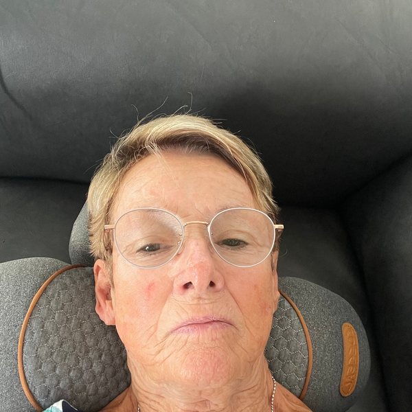 Myrta, a customer, lying back on the device.